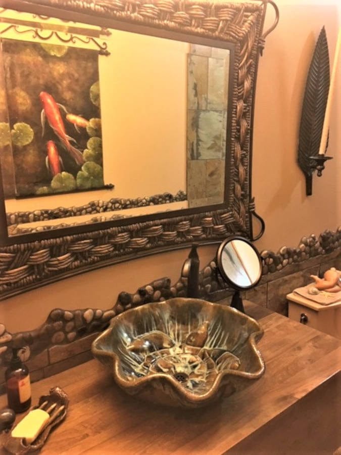 Ceramic Designs by Albert LLC Bathroom Sink Above vessel bathroom sink, with ultra turquoise & sandstone glazes, and eight relief turtles.